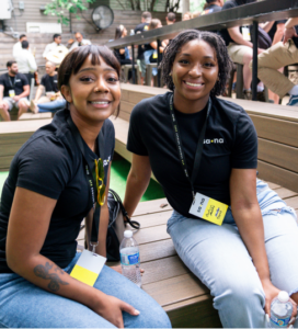 image: two Sana employees sitting next two each other